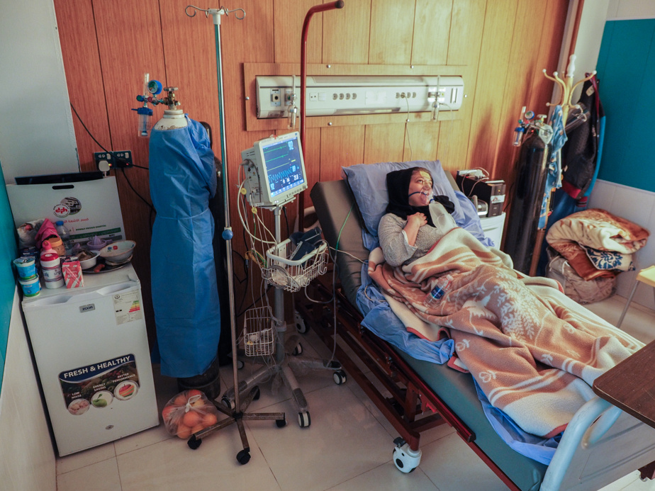Mayada Fadel, 57, in her intensive care unit.  She was hospitalized 12 days ago. 