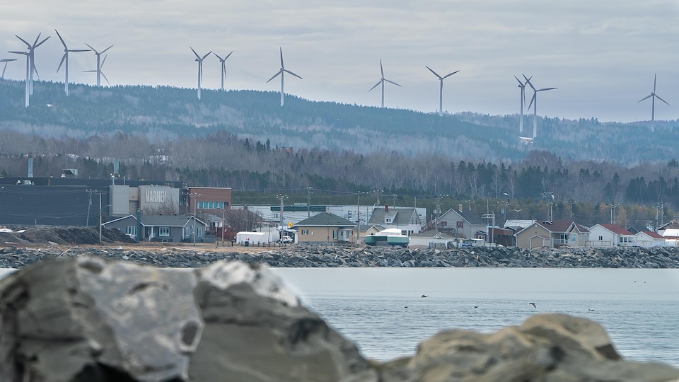 The Marmen Company on the banks of the Saint Lawrence River in Matane.  Wind turbines overlook the company's facilities.
