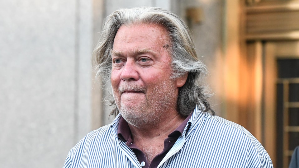 Steve Bannon walks out of a Manhattan courthouse, looking neglected.