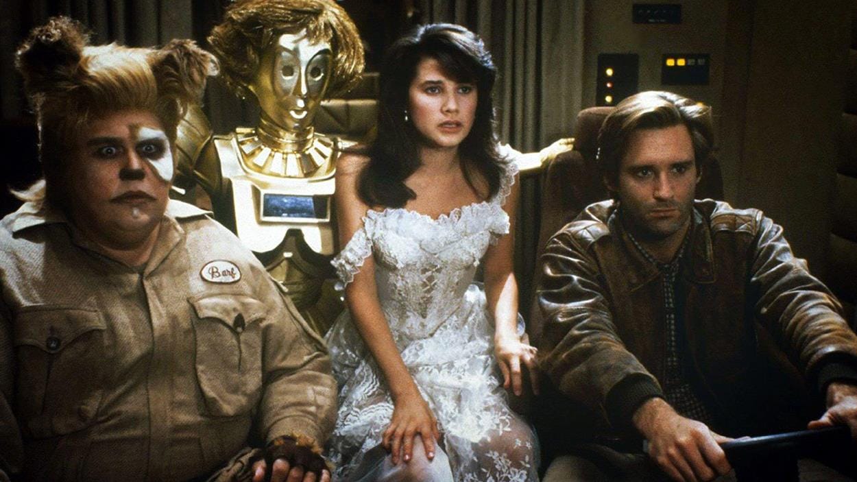 A space crew with a captain, a Dogan man, a bride, and a golden robot.