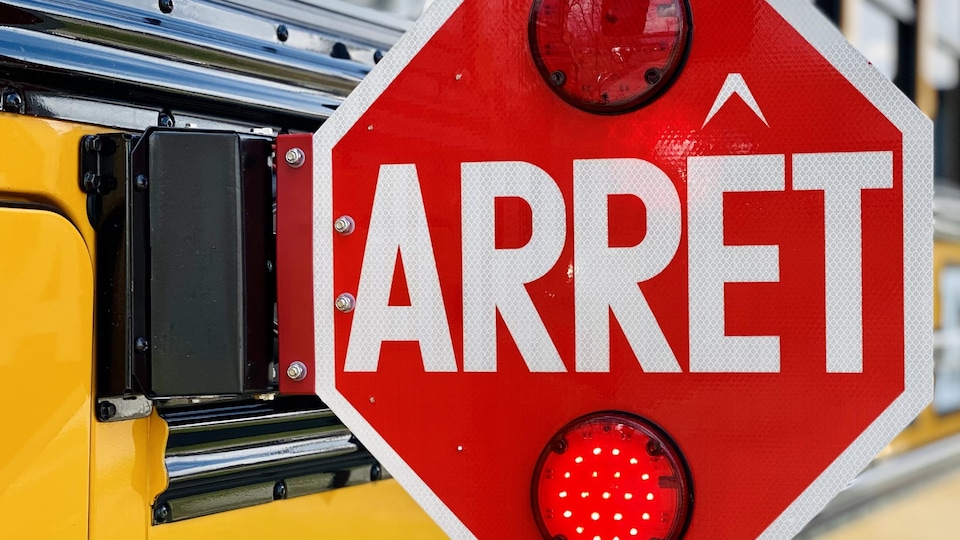 Close-up of a deployed school bus stop sign.