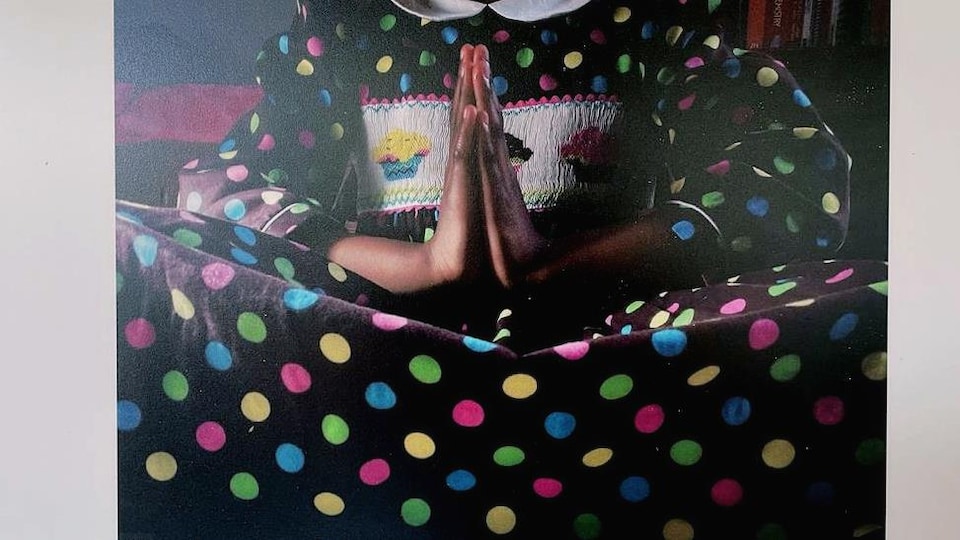 Little girl in a polka dot dress praying. 