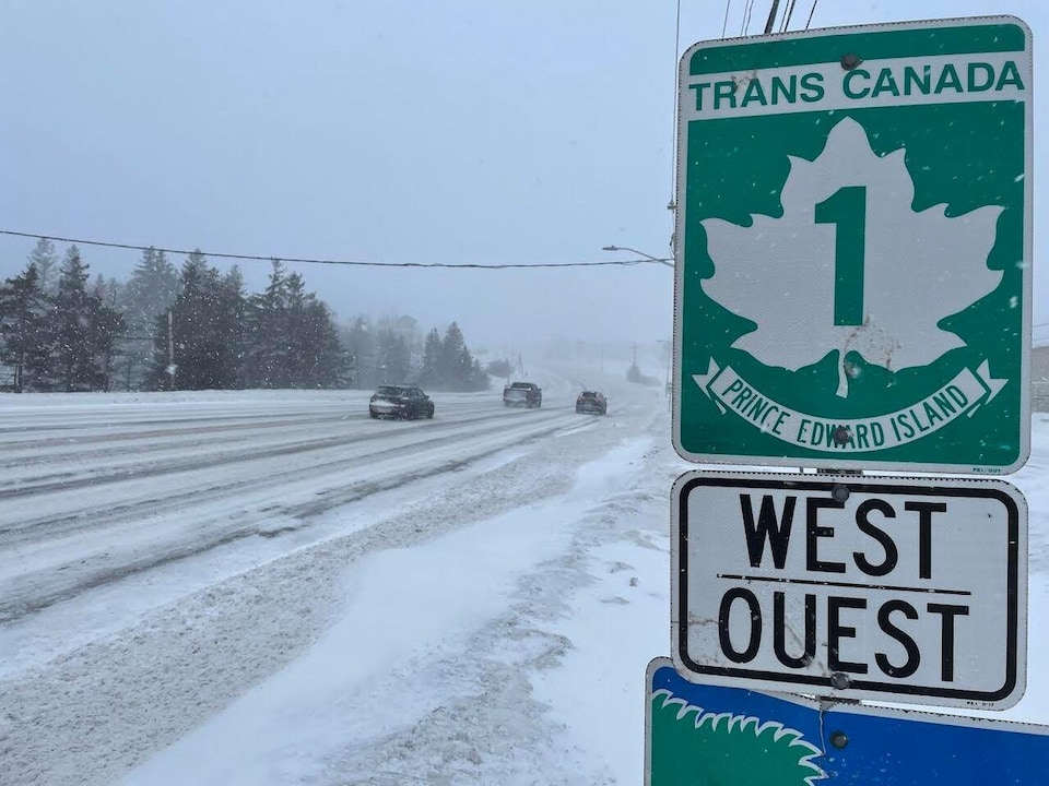 The road sign indicates that the snowy road is Trans-Canada Highway, Route 1, on Prince Edward Island.