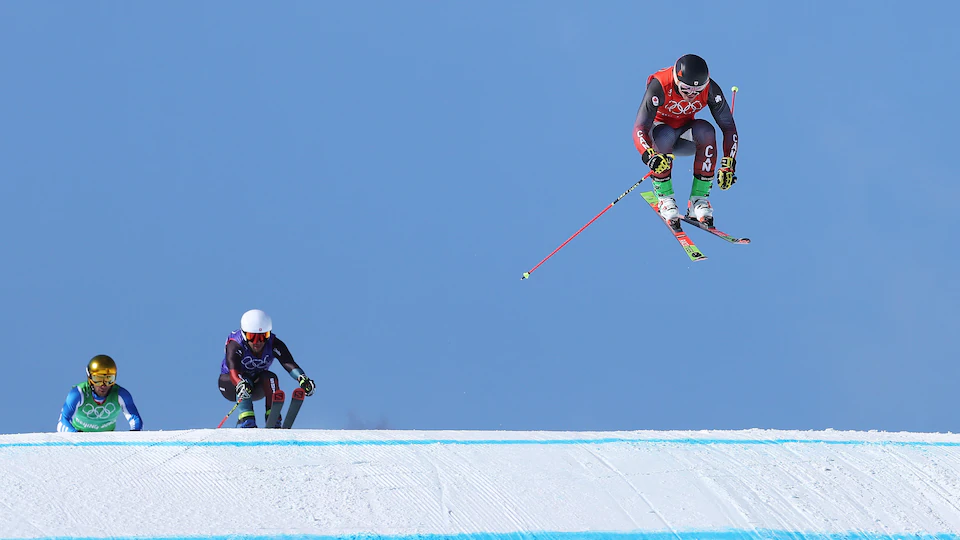 The skaters race first in the air and make a jump.