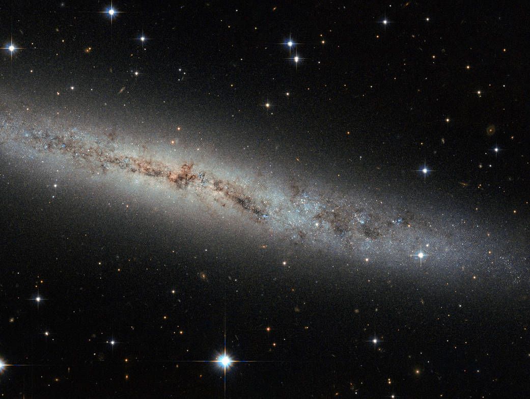 The spiral galaxy ESO 373-8 is located 25 million light-years away and is indicated as existing "flat like pancake" by NASA.