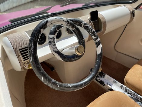 This amazing steering wheel is made of marble by a stone cutter.