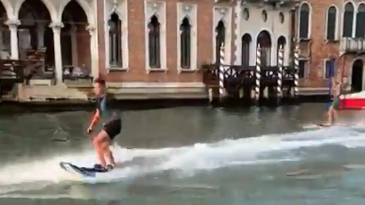 Venice mayor condemns 'two idiots' surfing on Grand Canal

